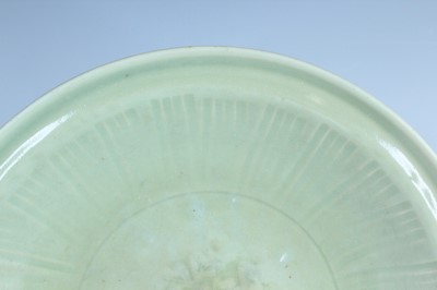 Lot 99 - A Chinese Longquan celadon dish, early Ming...