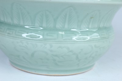 Lot 98 - A Chinese celadon censer and another tripod...