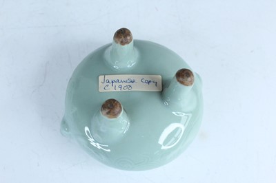 Lot 98 - A Chinese celadon censer and another tripod...