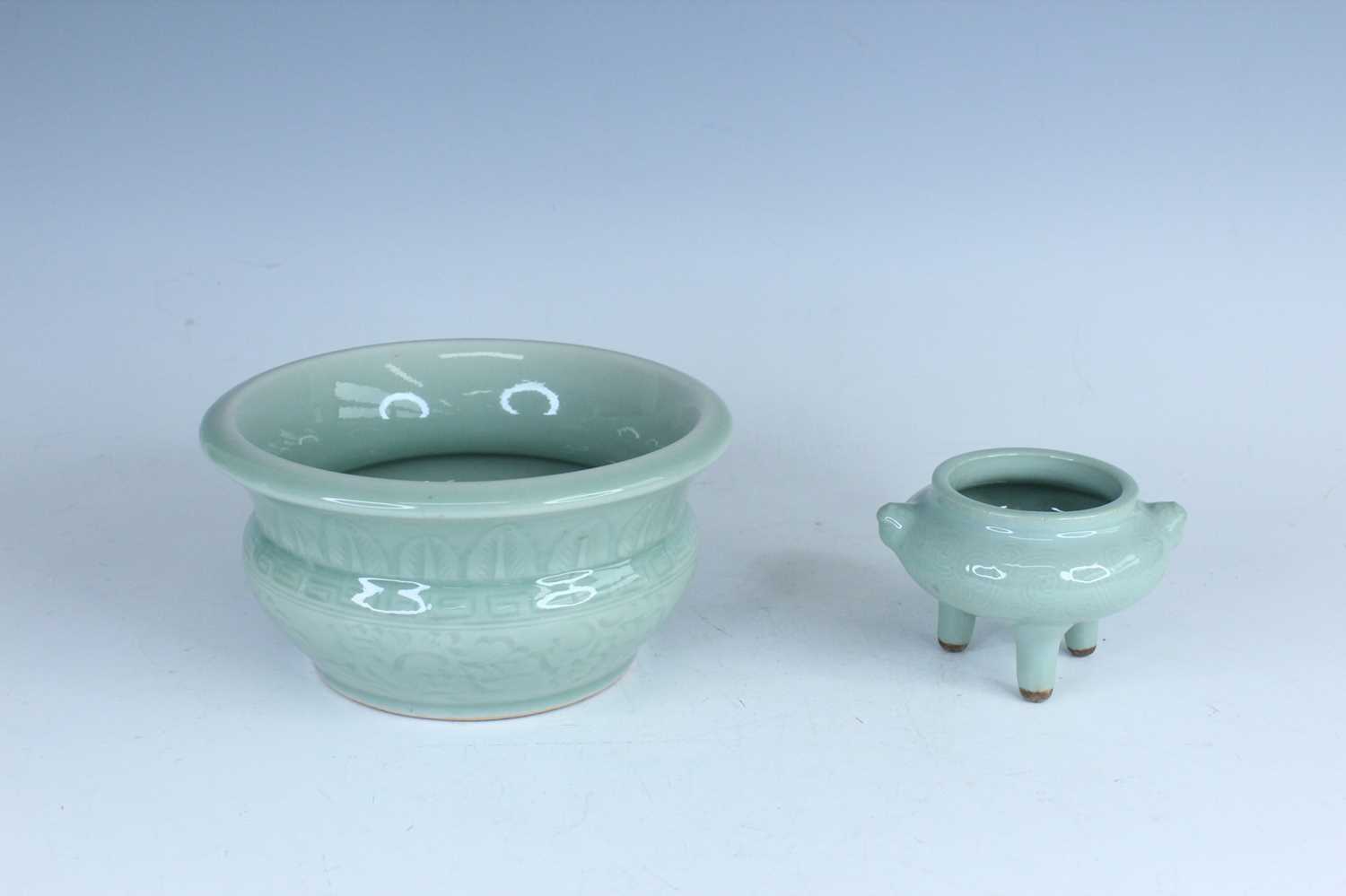 Lot 98 - A Chinese celadon censer and another tripod...