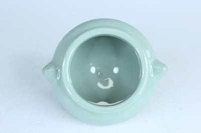 Lot 98 - A Chinese celadon censer and another tripod...