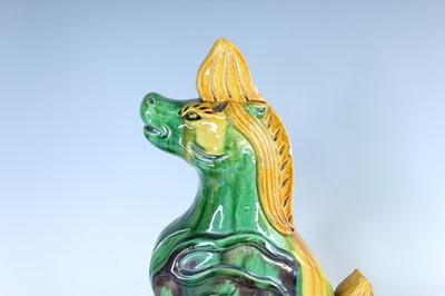 Lot 126 - A pair of Chinese sancai-glazed roof tile...