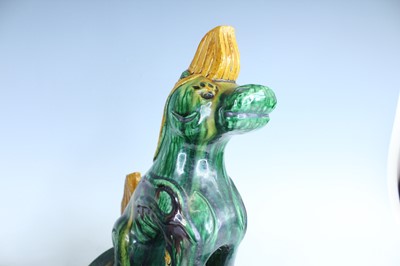 Lot 126 - A pair of Chinese sancai-glazed roof tile...