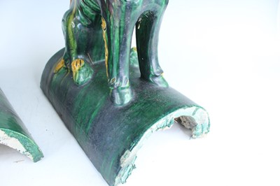 Lot 126 - A pair of Chinese sancai-glazed roof tile...
