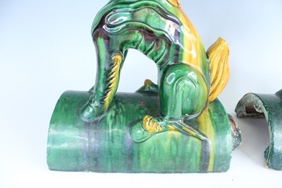 Lot 126 - A pair of Chinese sancai-glazed roof tile...