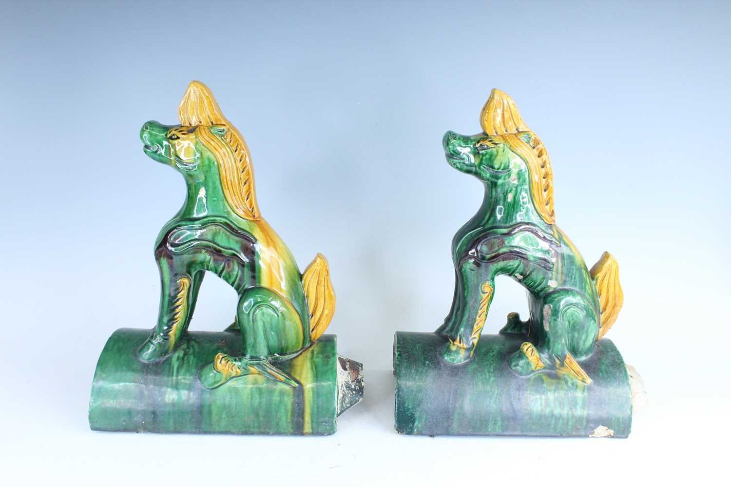 Lot 126 - A pair of Chinese sancai-glazed roof tile...