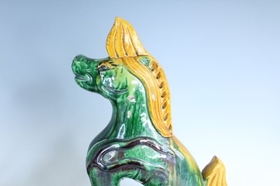 Lot 126 - A pair of Chinese sancai-glazed roof tile...