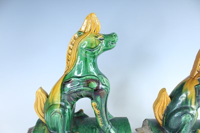 Lot 126 - A pair of Chinese sancai-glazed roof tile...