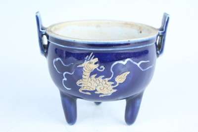 Lot 124 - A Chinese blue-glazed biscuit-relief decorated...