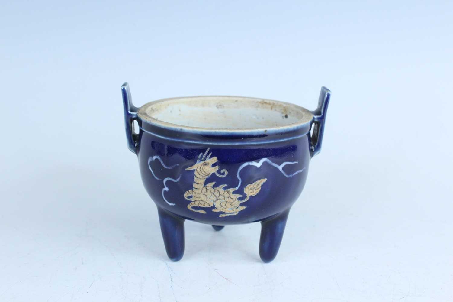 Lot 124 - A Chinese blue-glazed biscuit-relief decorated...