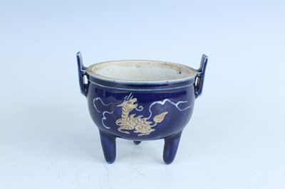 Lot 124 - A Chinese blue-glazed biscuit-relief decorated...