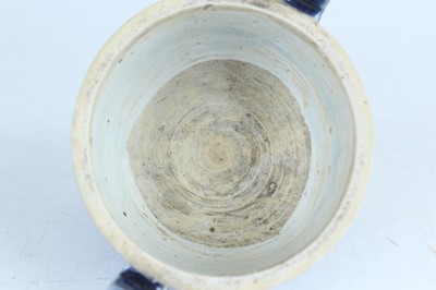 Lot 124 - A Chinese blue-glazed biscuit-relief decorated...