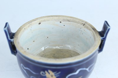 Lot 124 - A Chinese blue-glazed biscuit-relief decorated...