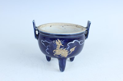 Lot 124 - A Chinese blue-glazed biscuit-relief decorated...