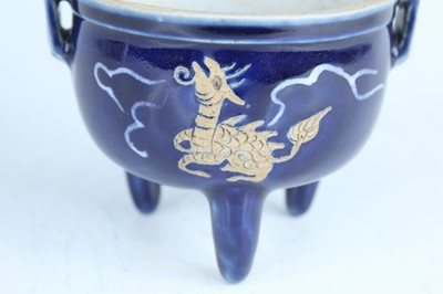 Lot 124 - A Chinese blue-glazed biscuit-relief decorated...