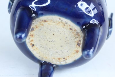 Lot 124 - A Chinese blue-glazed biscuit-relief decorated...