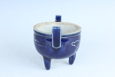 Lot 124 - A Chinese blue-glazed biscuit-relief decorated...