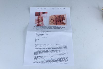 Lot 45 - A Chinese painted wooden figure of a rider on...