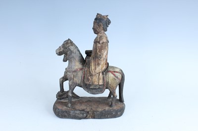 Lot 45 - A Chinese painted wooden figure of a rider on...