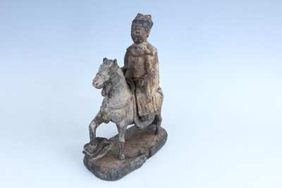 Lot 45 - A Chinese painted wooden figure of a rider on...