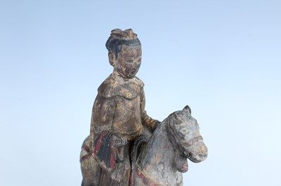Lot 45 - A Chinese painted wooden figure of a rider on...