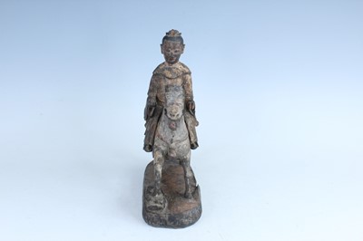 Lot 45 - A Chinese painted wooden figure of a rider on...