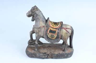 Lot 45 - A Chinese painted wooden figure of a rider on...