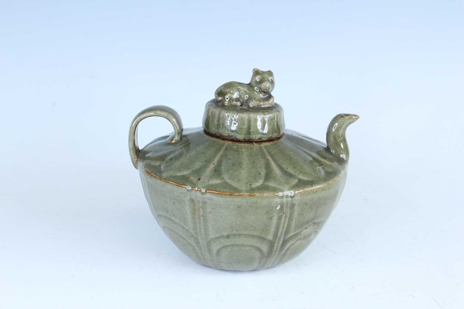 Lot 103 - A Chinese Longquan-type celadon teapot, in...