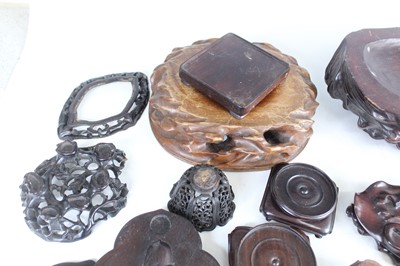 Lot 46 - A collection of Chinese wooden stands and...