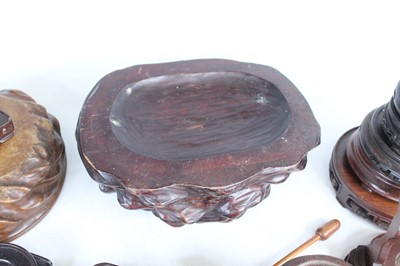 Lot 46 - A collection of Chinese wooden stands and...