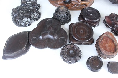 Lot 46 - A collection of Chinese wooden stands and...