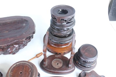 Lot 46 - A collection of Chinese wooden stands and...