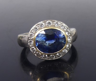 Lot 2557 - An 18ct white gold sapphire and diamond round...