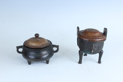 Lot 69 - Two Chinese bronze tripod censers, Qing...