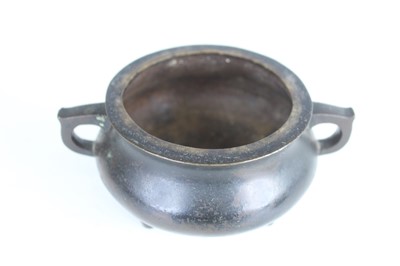 Lot 69 - Two Chinese bronze tripod censers, Qing...