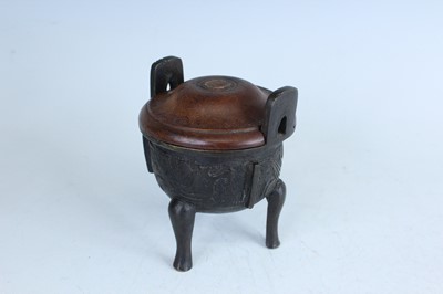 Lot 69 - Two Chinese bronze tripod censers, Qing...