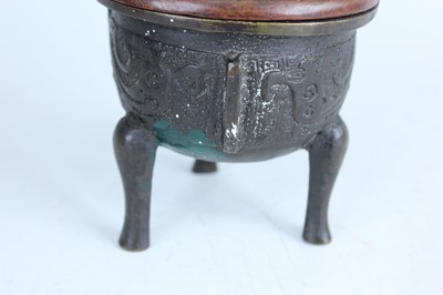 Lot 69 - Two Chinese bronze tripod censers, Qing...