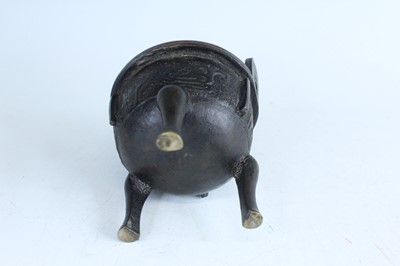 Lot 69 - Two Chinese bronze tripod censers, Qing...