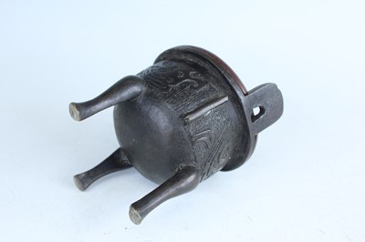 Lot 69 - Two Chinese bronze tripod censers, Qing...