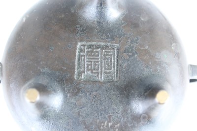 Lot 69 - Two Chinese bronze tripod censers, Qing...