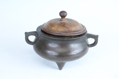 Lot 69 - Two Chinese bronze tripod censers, Qing...