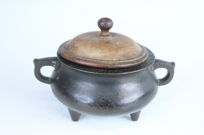 Lot 69 - Two Chinese bronze tripod censers, Qing...