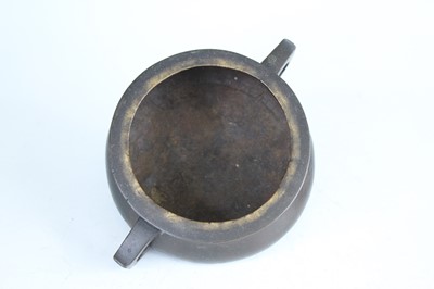 Lot 69 - Two Chinese bronze tripod censers, Qing...