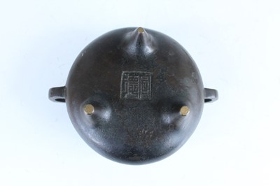 Lot 69 - Two Chinese bronze tripod censers, Qing...