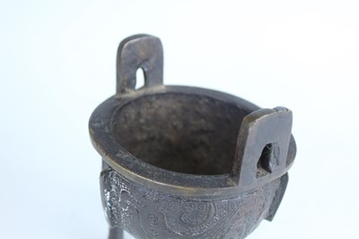 Lot 69 - Two Chinese bronze tripod censers, Qing...