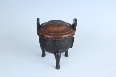 Lot 69 - Two Chinese bronze tripod censers, Qing...