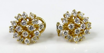 Lot 2566 - A pair of 18ct gold diamond cluster ear studs,...