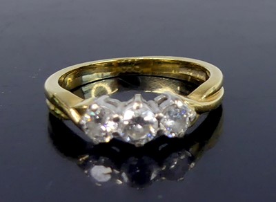Lot 2564 - An 18ct yellow and white gold diamond...