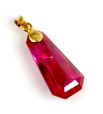 Lot 2681 - A yellow metal synthetic ruby pendant, the...