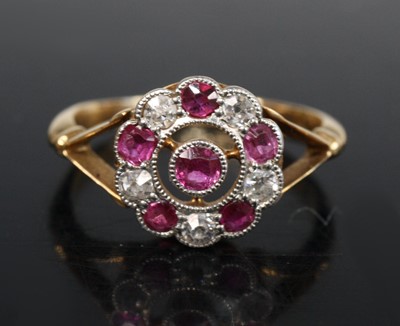 Lot 2682 - An 18ct gold ruby and diamond circular cluster...
